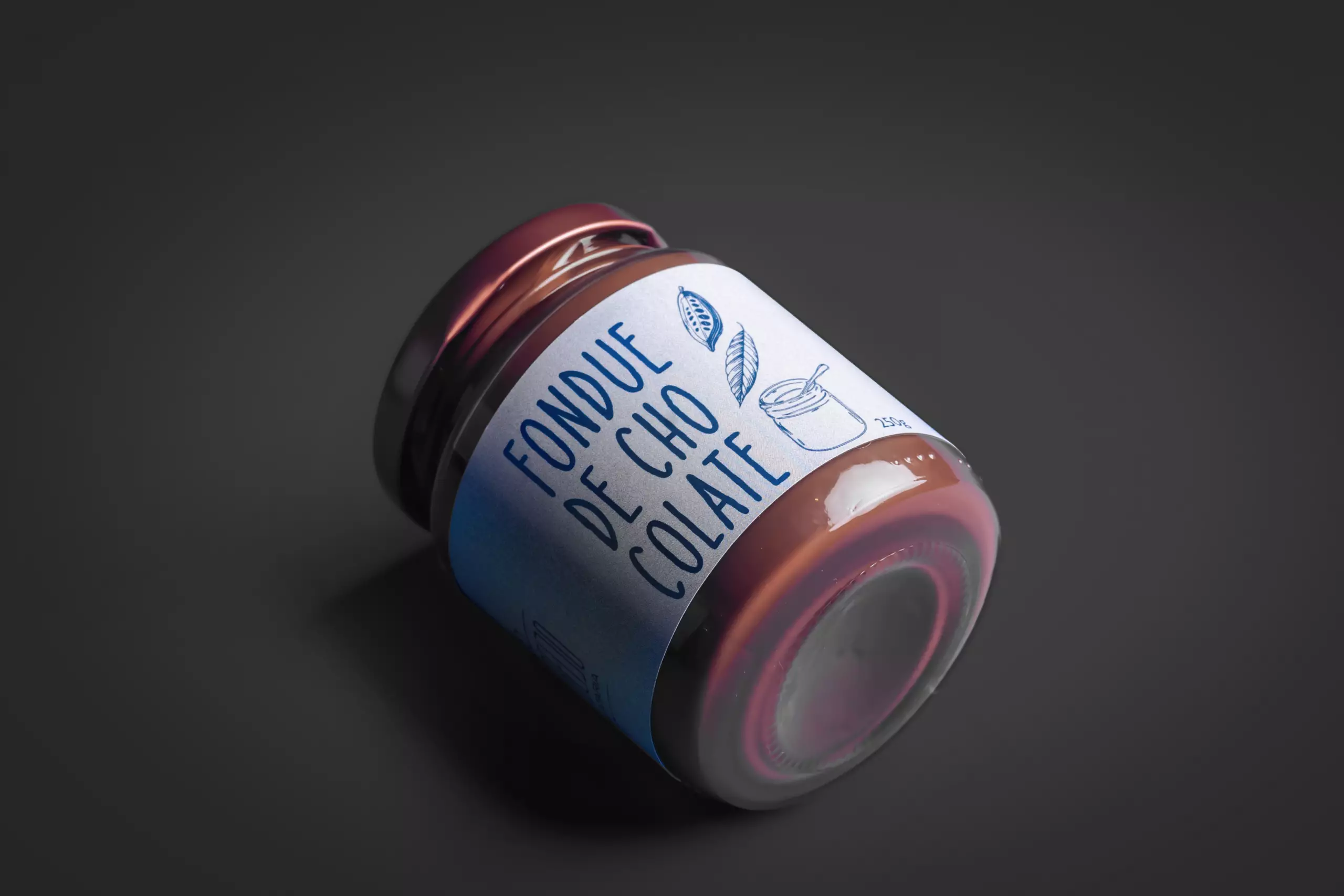 embalagem de fondue de chocolate belga, deitado sobre um fundo escuro